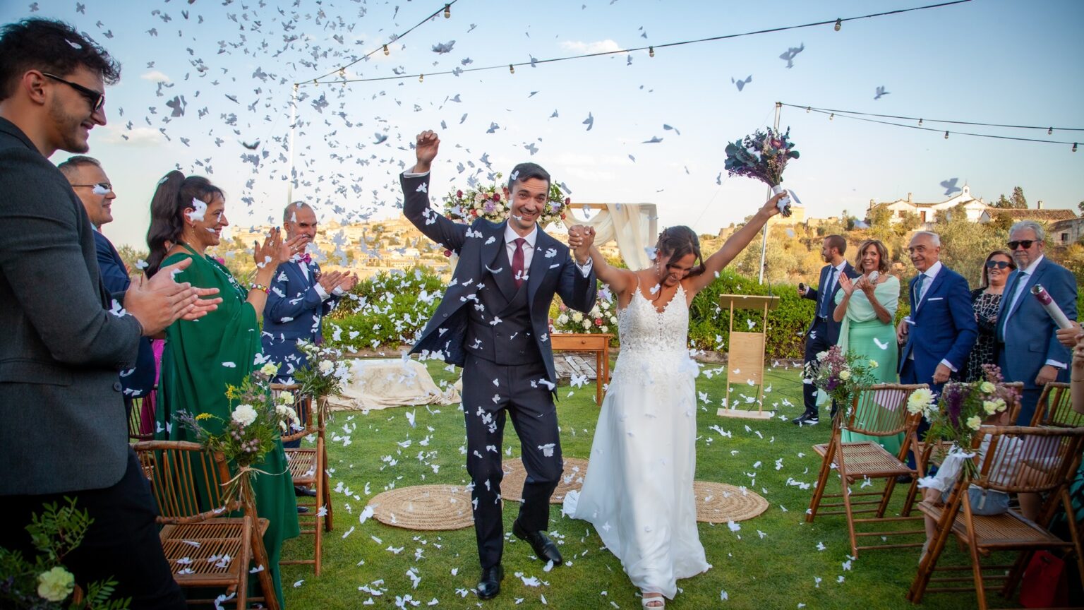 Couple walking down the aisle in a summer wedding in Spain