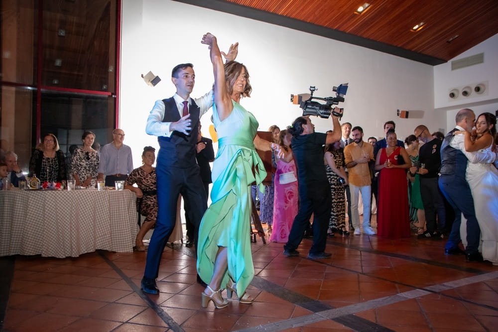 Bride and groom dancing with their parents at Spanish wedding