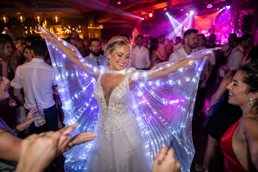 Bride with LED cape at Spanish wedding